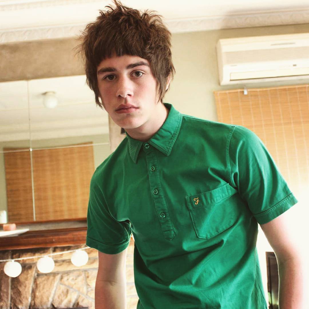 a guy with a retro 60s hairstyle