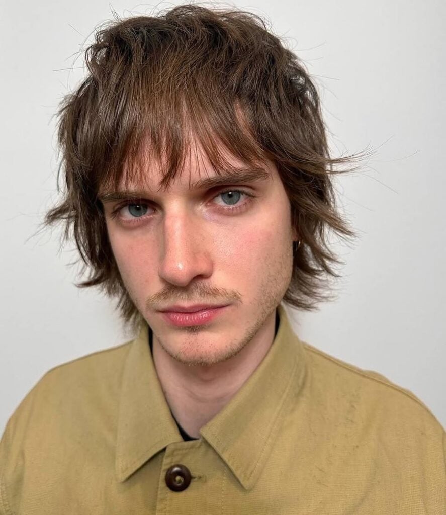 a guy with a modern mod haircut