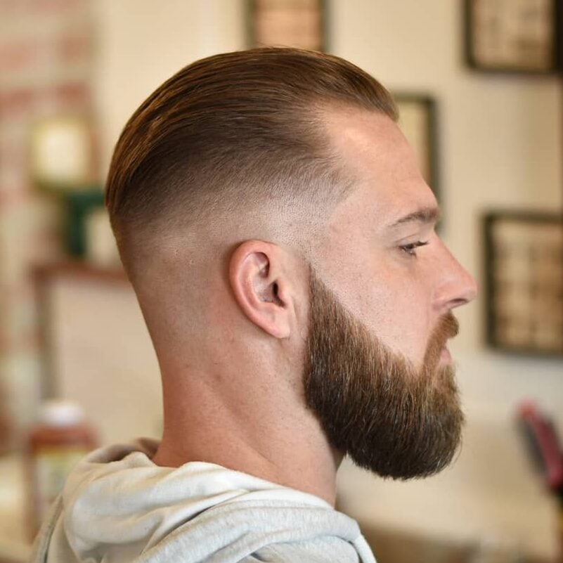 slicked back modern haircut