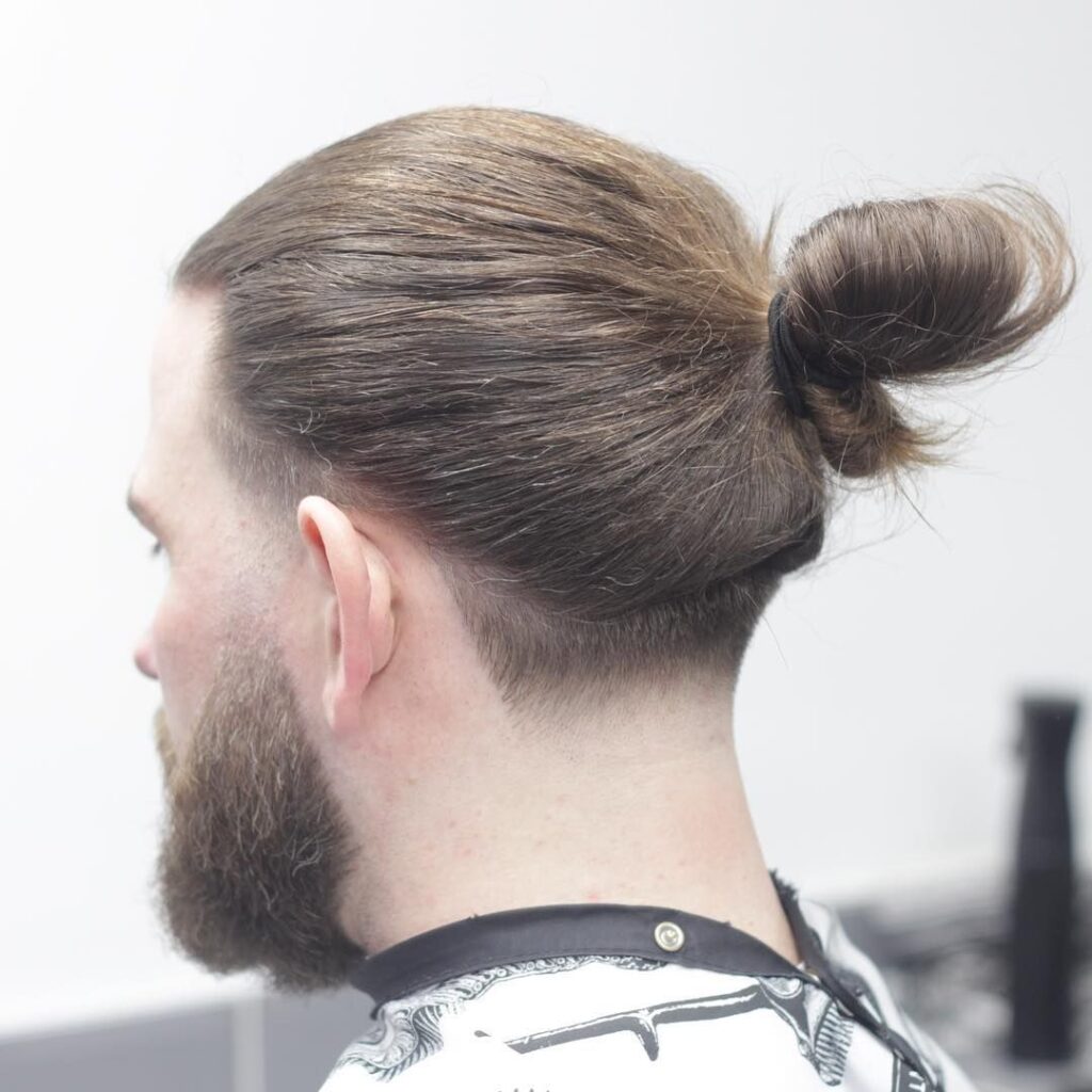 top knot haircut with tapered sides