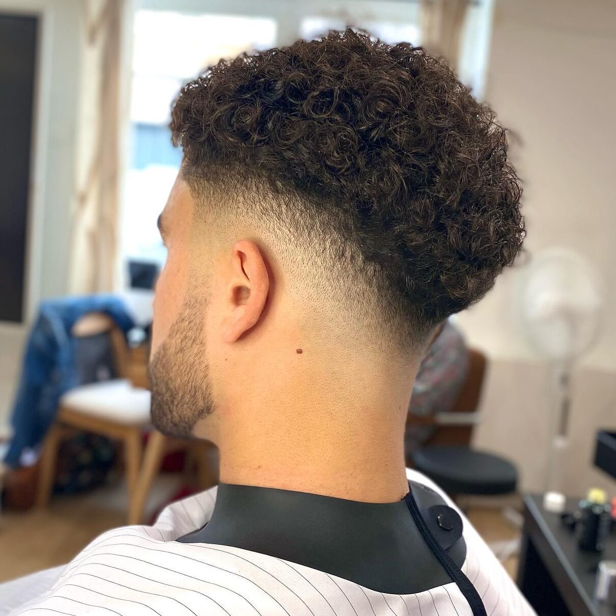 mid fade with curly hair