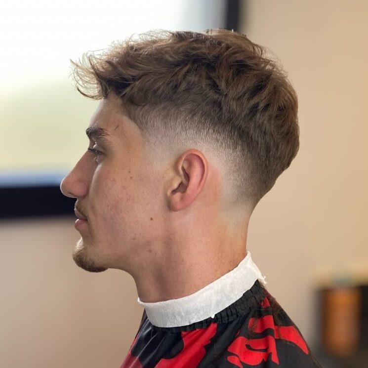 a guy with a mid fade