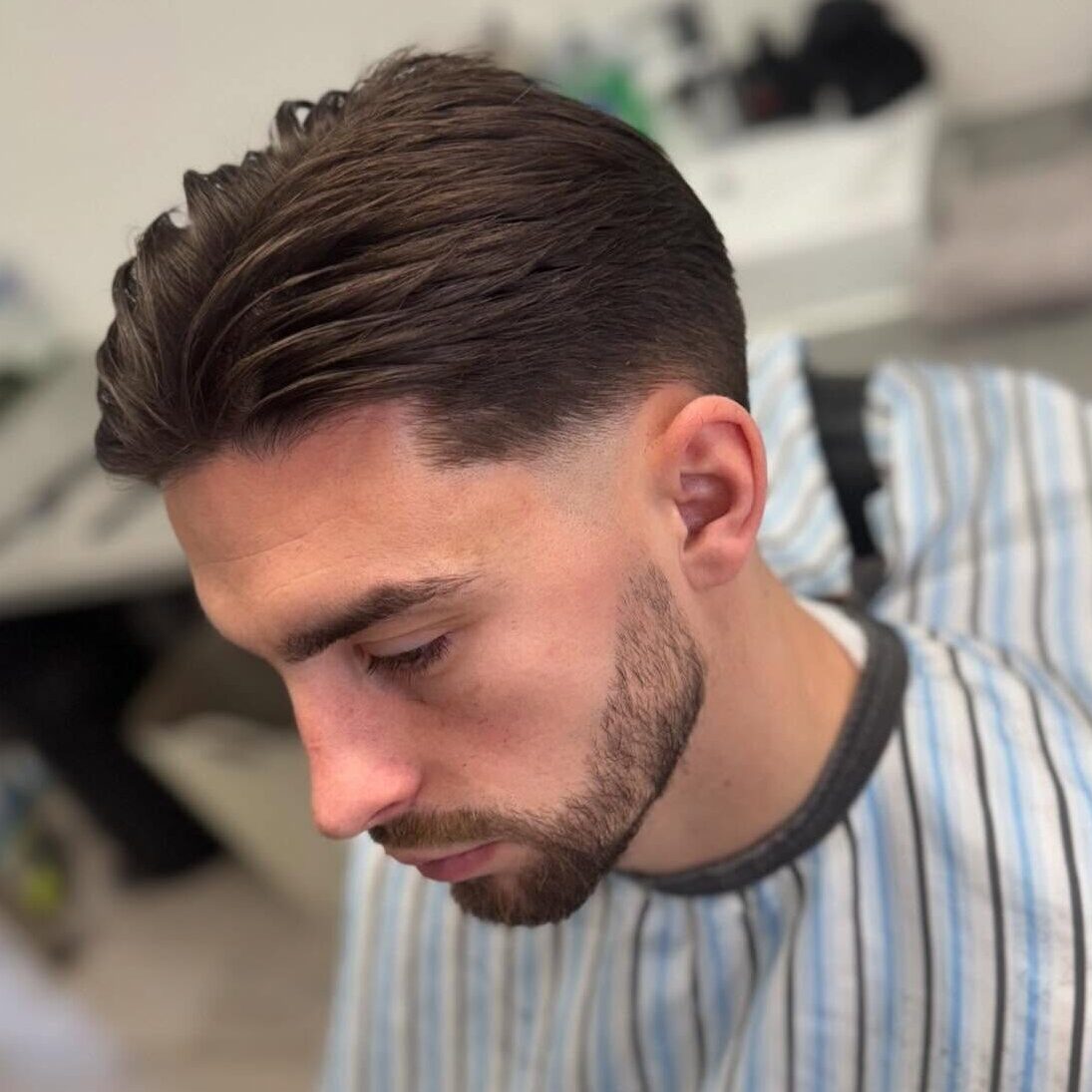brushed bad haircut with taper