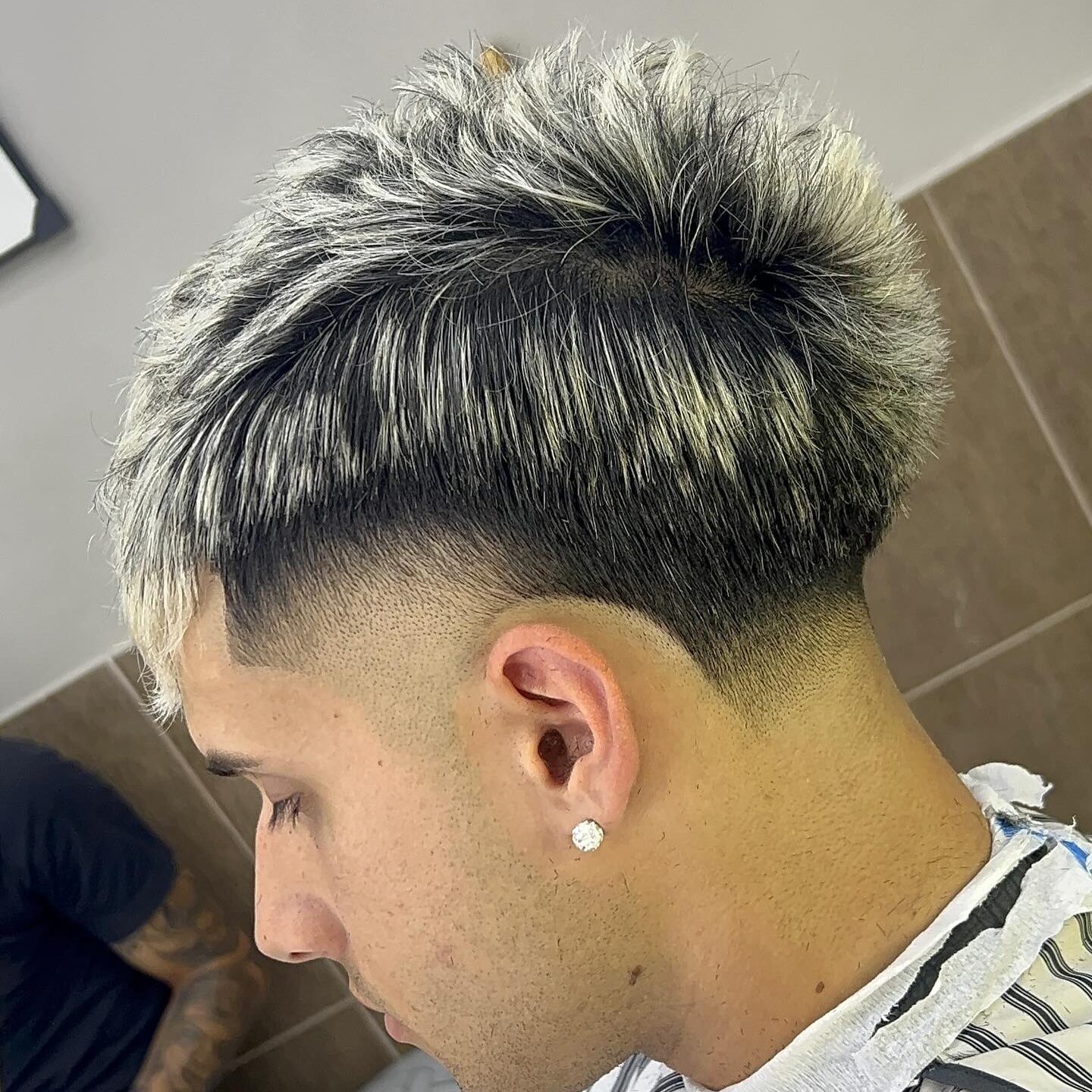 dirty blonde highlights with mid-to-high taper fade