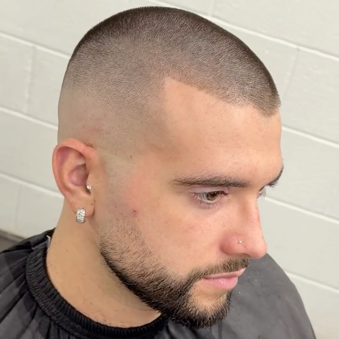 a male model with a number 1 buzz cut